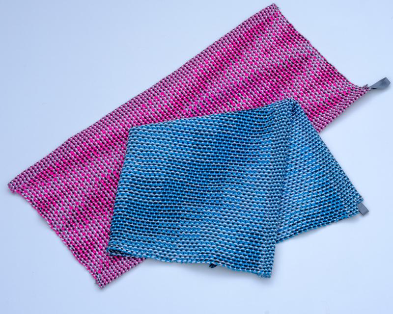 Overview shot of the handwoven turquoise kitchen towel and pink guest towel using the corris effect