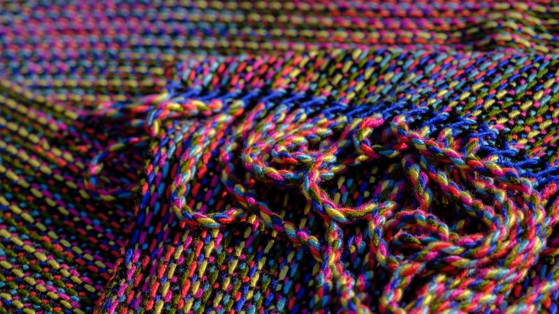 Close-up of multi-colored fringes on a shawl