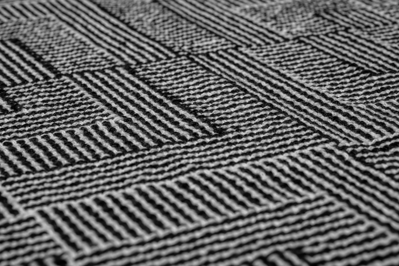 Another close-up of a handwoven shawl in shadow weave using black & white yarn merino wool and pima cotton