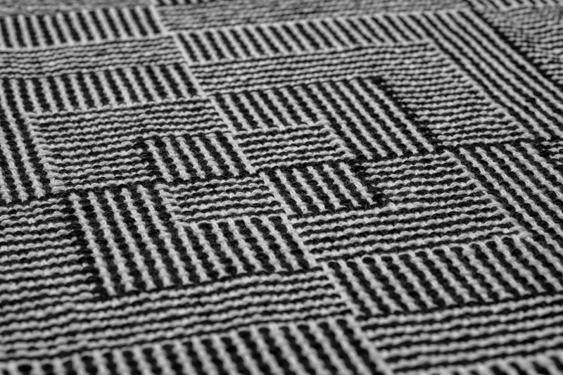 Close-up of a handwoven shawl in shadow weave using black & white yarn merino wool and pima cotton