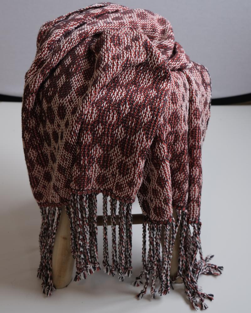 Shawl hanging from a stool