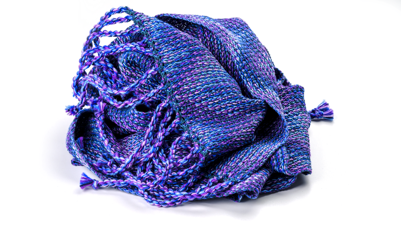 Shawl in echo weave thrown in a bunch, using only shades of blue and purple in the warp