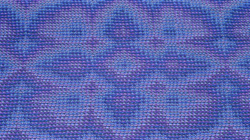 One pattern repeat of a flower woven in echo-8 using shades of blue and purple