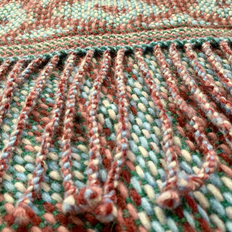 Twisted fringes straight across the shawl