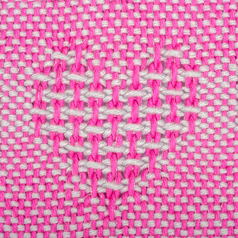 Heart-shaped motif woven in Huck Lace