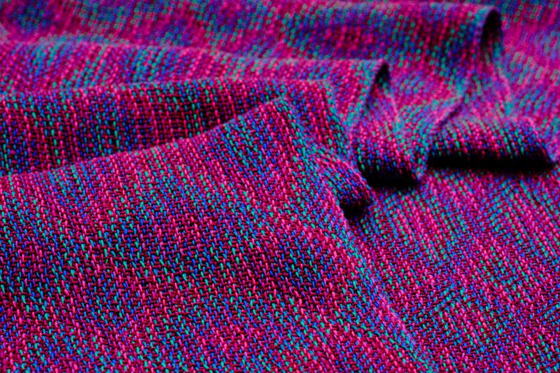 Close-up of a pleated, handwoven shawl in echo weave.