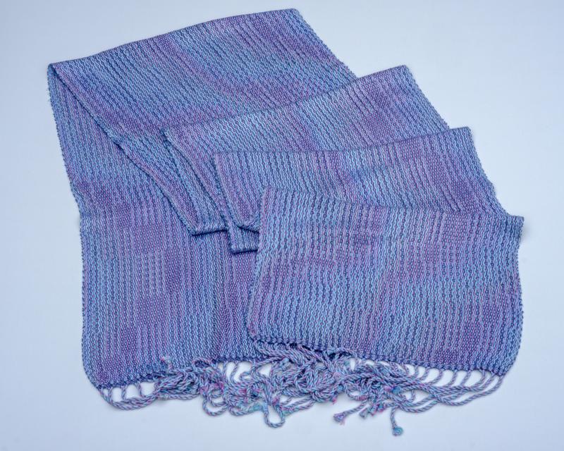 Overview shot of a handwoven shawl in lyocell yarn using the Corris effect