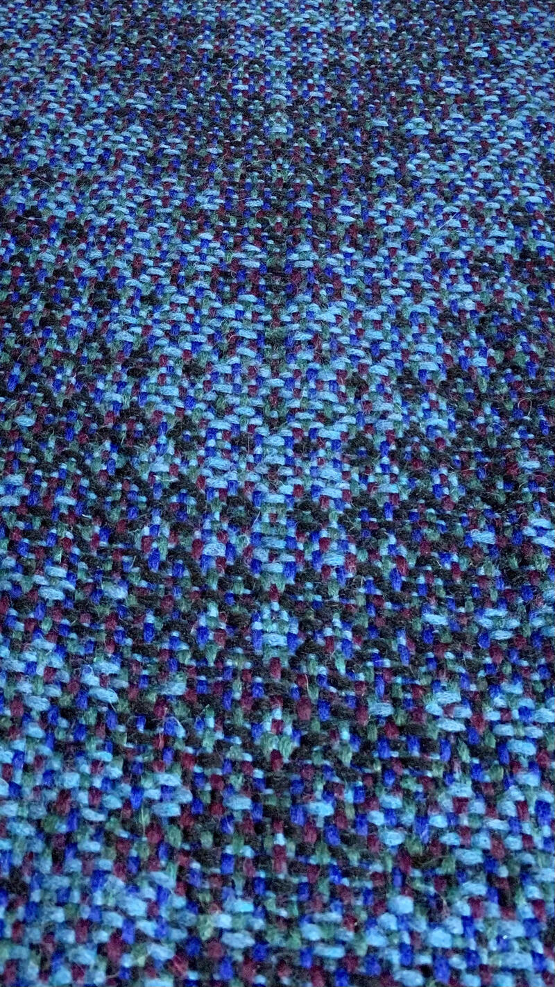 Shawl in shades of blue at a perspective.