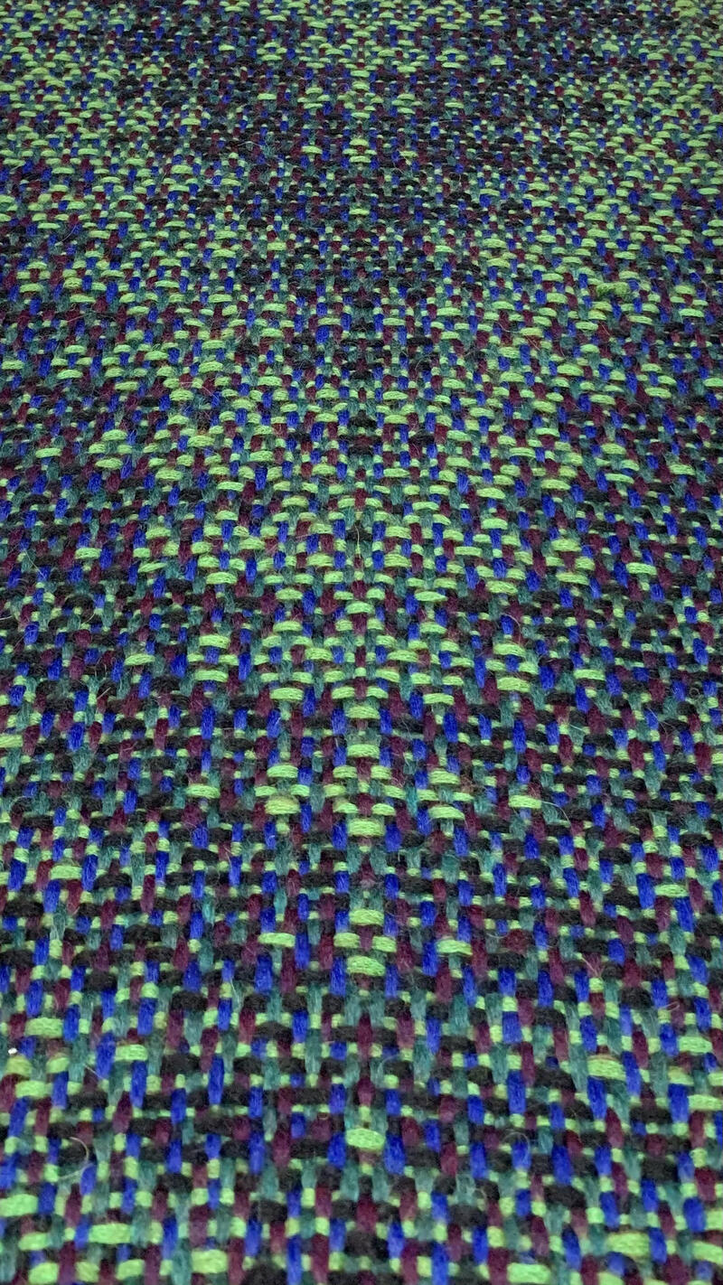 Shawl in shades of green at a perspective.