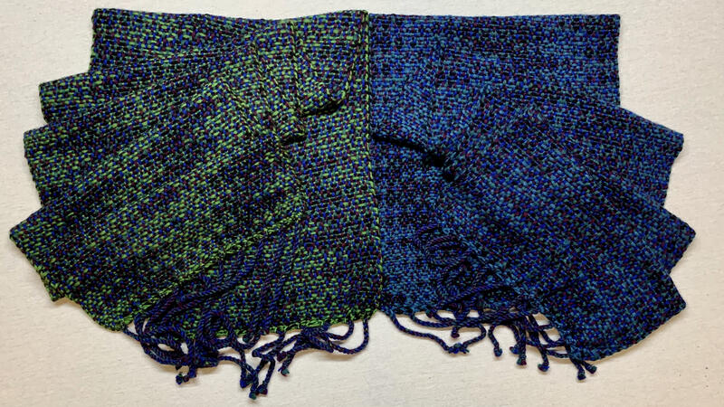 A matching pair of shawls using an advancing point twill pattern